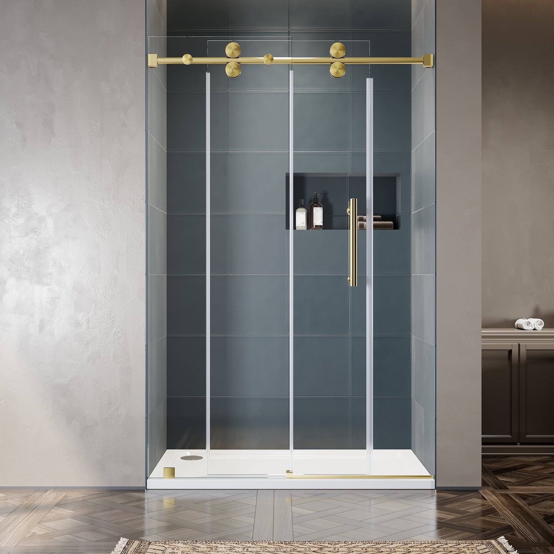 Frameless double sliding shower door with brushed gold top rail and clear 10mm tempered glass installed in a modern bathroom with dark slate tile wall
