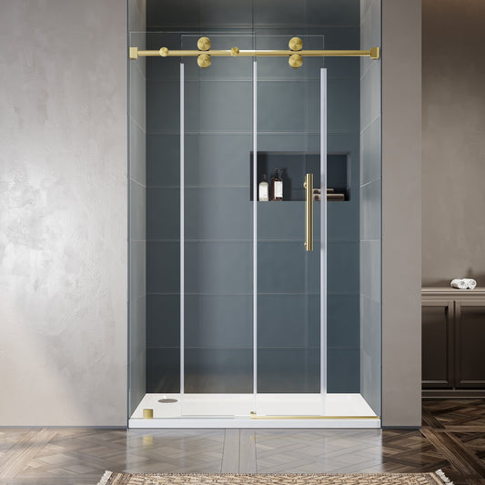 Frameless double sliding shower door with brushed gold top rail and clear 10mm tempered glass installed in a modern bathroom with dark slate tile wall